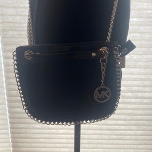 Black leather silver chain Michael Kors crossbody/shoulder bag. 8” W X 7” H